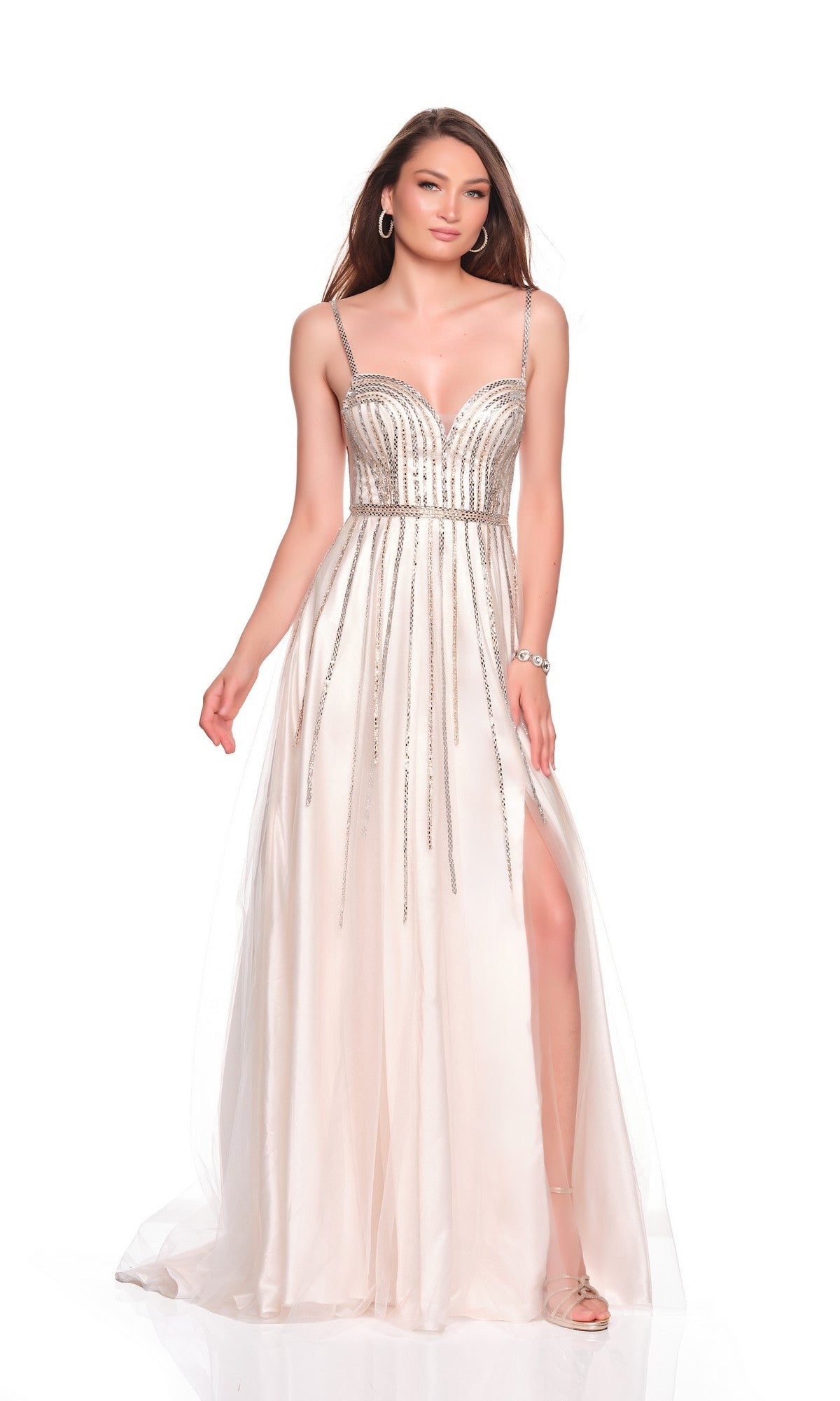 A woman wearing the Dave and Johnny 12842 long prom dress, featuring a sleeveless design, light color, metallic embellishments, beaded bodice, and thigh-high slit, stands against a plain white background.